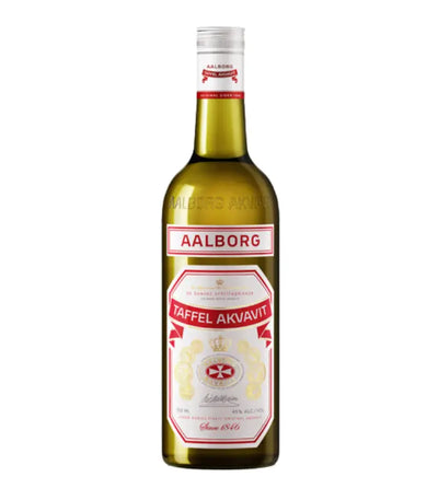 Aalborg Taffel Aquavit comes in a green glass bottle with a white and red label, gold accents, and a white cap. The label includes the Aalborg Taffel brand name and product details.