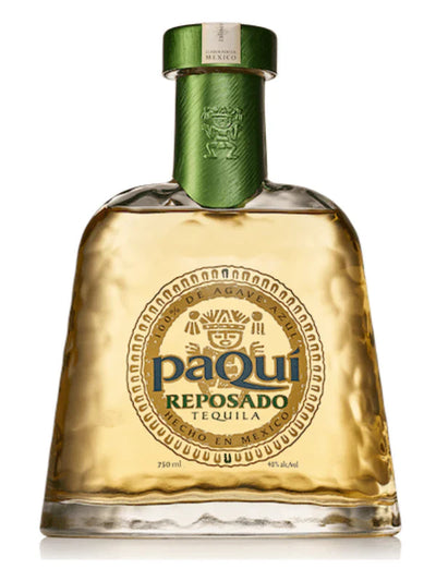 A bottle of PaQui Reposado Tequila by Paqui, made in Jalisco, Mexico from Blue Weber Agave, featuring a wide base, green cap, and a gold Aztec-style label with the brand name.