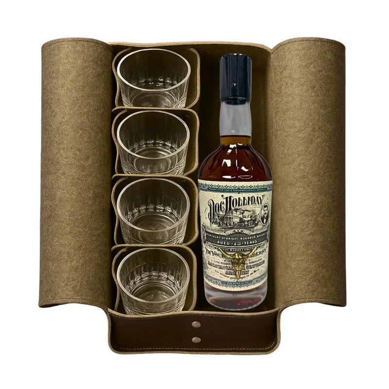 A brown leather case holds four clear glasses and a bottle of Doc Holliday 13 Year Doctor&