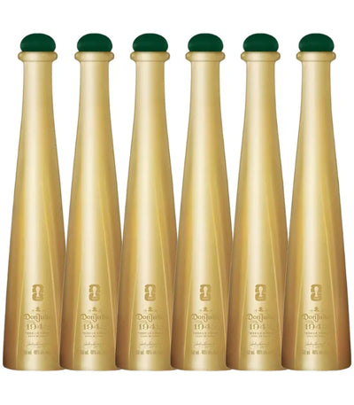 Six gold-colored bottles with green tops are lined up, each labeled Don Julio 1942 FIFA World Cup 2026 Limited Edition 50mL by Don Julio, featuring embossed details on the front.