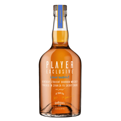 A bottle of Gentleman's Cut Player Exclusive José Andrés PX Sherry Cask 10 Year Bourbon, featuring “10 Year Old” and signatures on the label, plus a gold and blue neck tag, stands out next to the Gentleman's Cut José Andrés Edition.