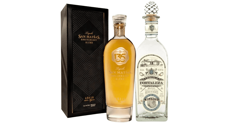 Two bottles from Main Street Liquor’s Heritage Reserve Collection are shown: San Matías 135th Anniversary Añejo with a decorative box, and Fortaleza Blanco featuring a clear bottle and patterned stopper, showcasing tequila artistry.