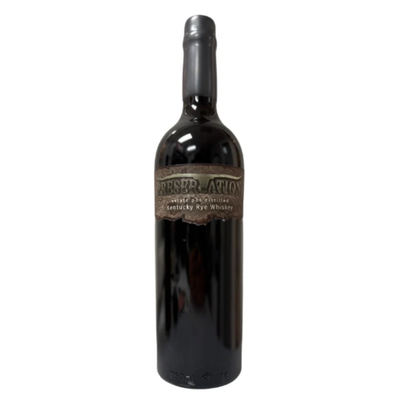 A 750mL dark glass bottle of Preservation Estate Pot Distilled Kentucky Rye Whiskey stands upright, featuring a wax-sealed top and rustic brown label by Preservation, set against a plain white background.