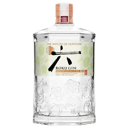 A clear, hexagonal glass bottle of Suntory Roku Gin Minori Select Edition, limited edition Japanese gin, with decorative embossing, a white label with Japanese characters and botanicals, and a wooden cap topped by a red seal.